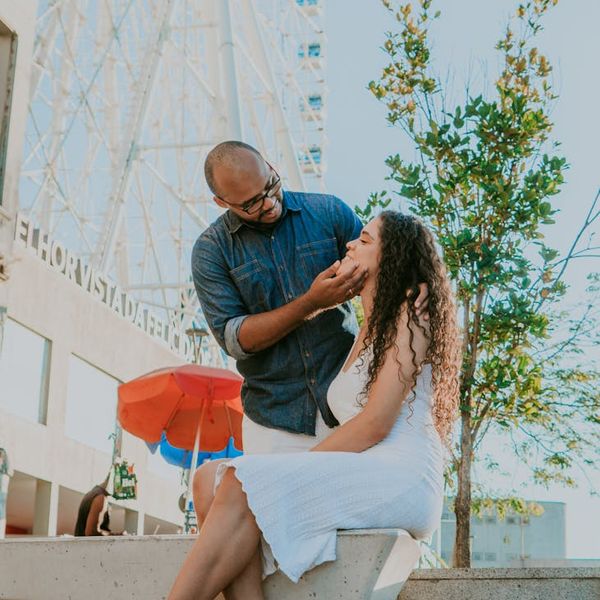 A man stretching, feeling energized and refreshed in a bright space.